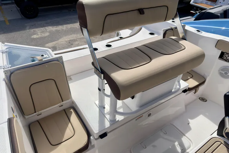 Slide: The Image of 2025 Yamaha Boats 222 FSH Sport interior seating with beige upholstery and modern design. - 17