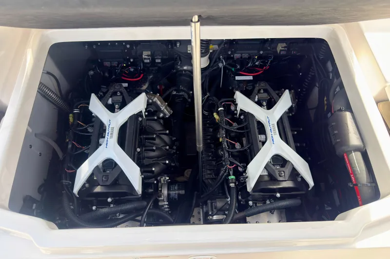 Slide: The Image of 2025 Yamaha Boats 222 FSH Sport engine compartment with dual high-output engines. - 32