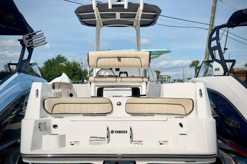 Slide: The Image of 2025 Yamaha Boats 222 FSH Sport, rear view, showcasing seating and sleek design. - 5