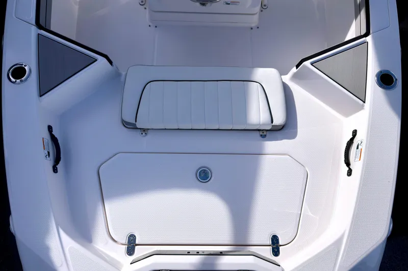 Slide: The Image of 2025 Yamaha Boats 195 FSH Sport interior, featuring sleek seating and storage compartments. - 15