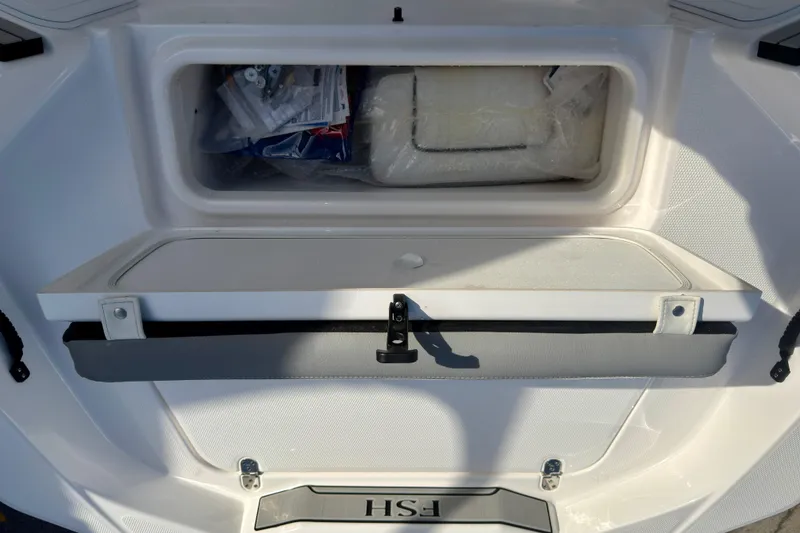 Slide: The Image of Storage compartment of 2025 Yamaha Boats 195 FSH Sport, showcasing interior space and design. - 17