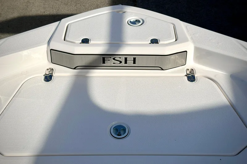 Slide: The Image of 2025 Yamaha Boats 195 FSH Sport deck with FSH emblem and sleek design. - 18