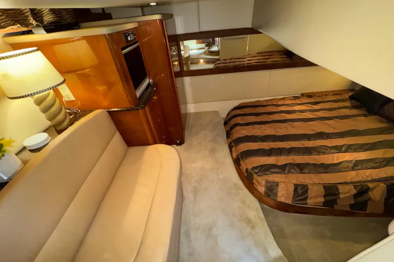 Slide: The Image of Luxurious interior of 2007 Meridian 411 Sedan with cozy seating and striped bedding. - 13