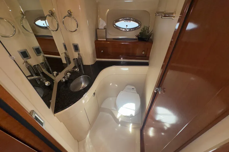 Slide: The Image of Luxurious bathroom in a 2007 Meridian 411 Sedan yacht with modern fixtures. - 14