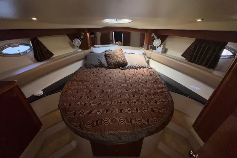 Slide: The Image of Luxurious bedroom interior of 2007 Meridian 411 Sedan yacht with cozy bedding. - 19
