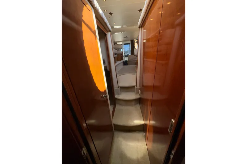 Slide: The Image of Interior hallway of a 2007 Meridian 411 Sedan yacht with wooden paneling. - 20
