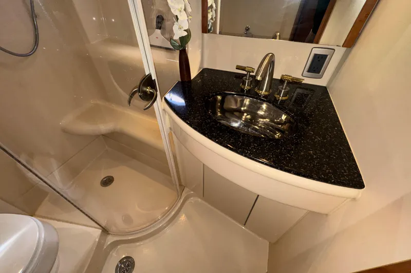 Slide: The Image of Luxurious bathroom in 2007 Meridian 411 Sedan yacht with sleek sink and shower. - 21