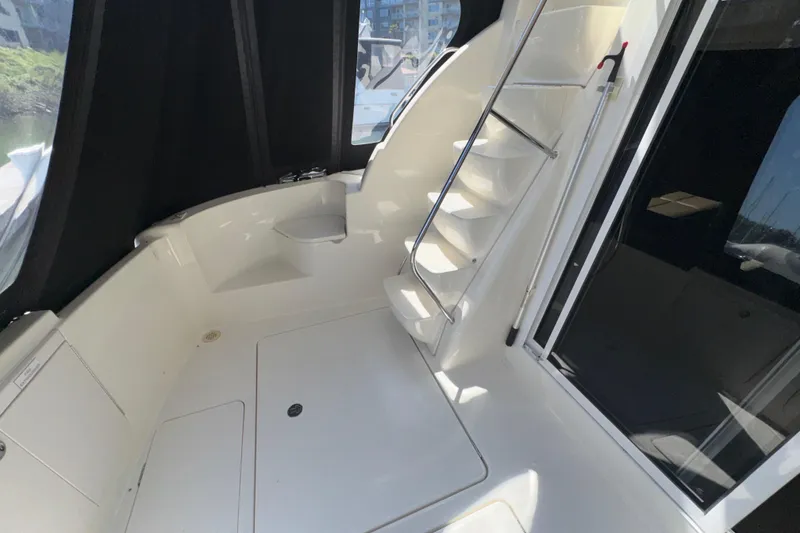Slide: The Image of 2007 Meridian 411 Sedan boat interior with stairs and seating area. - 23