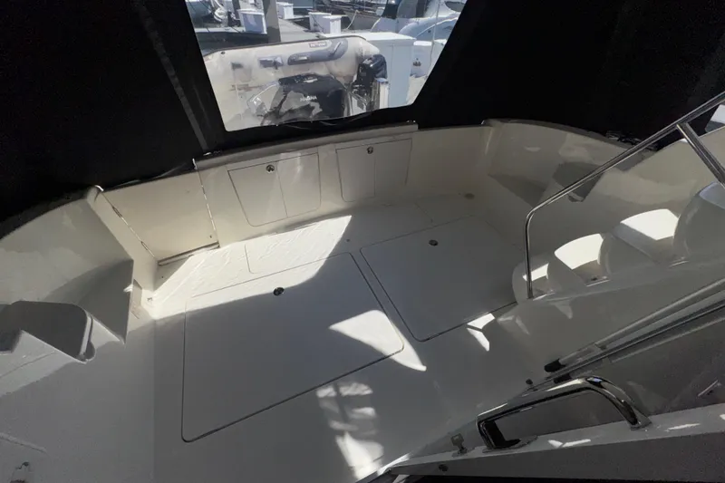 Slide: The Image of 2007 Meridian 411 Sedan boat interior with seating and storage compartments. - 25
