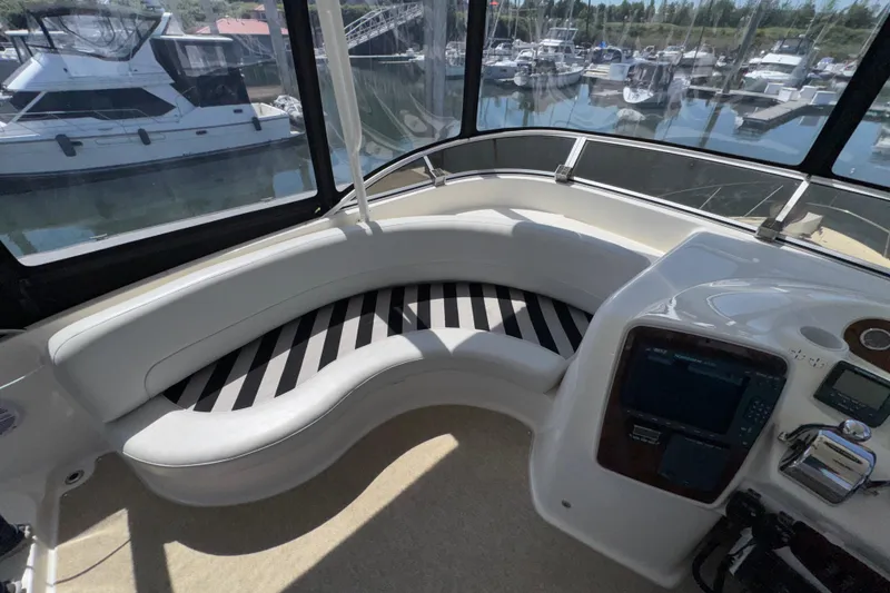 Slide: The Image of Interior of 2007 Meridian 411 Sedan yacht with curved seating and control panel. - 26