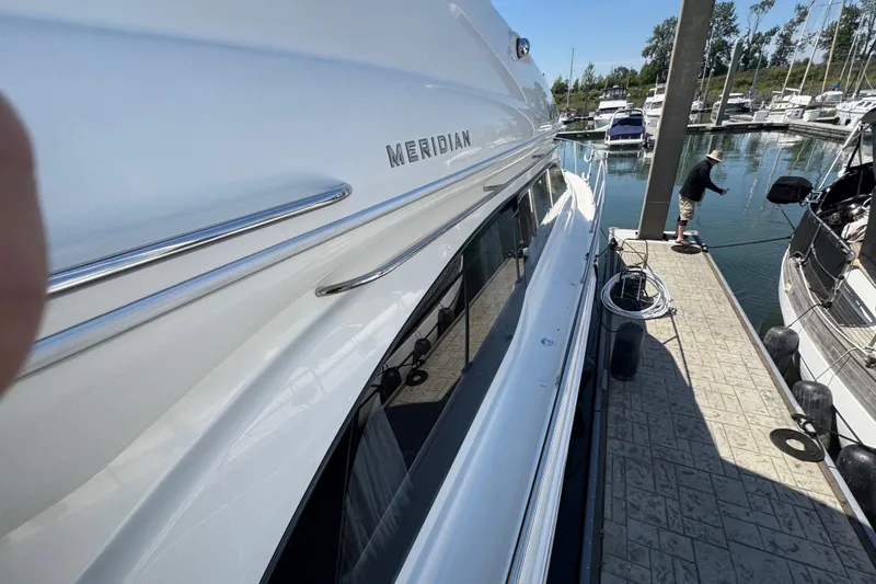 Slide: The Image of 2007 Meridian 411 Sedan yacht docked at marina with clear sky. - 35