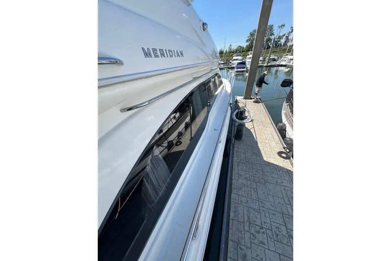 Slide: The Image of 2007 Meridian 411 Sedan yacht docked at marina, side view. - 36