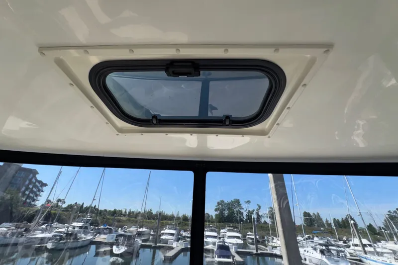 Slide: The Image of 2007 Meridian 411 Sedan sunroof view overlooking marina with docked boats. - 37