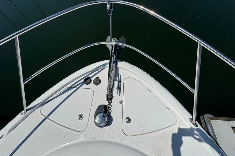 Slide: The Image of Bow of 2007 Meridian 411 Sedan yacht with anchor chain and railing. - 38