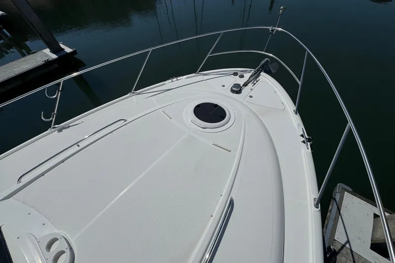 Slide: The Image of 2007 Meridian 411 Sedan yacht bow, docked in calm waters. - 39