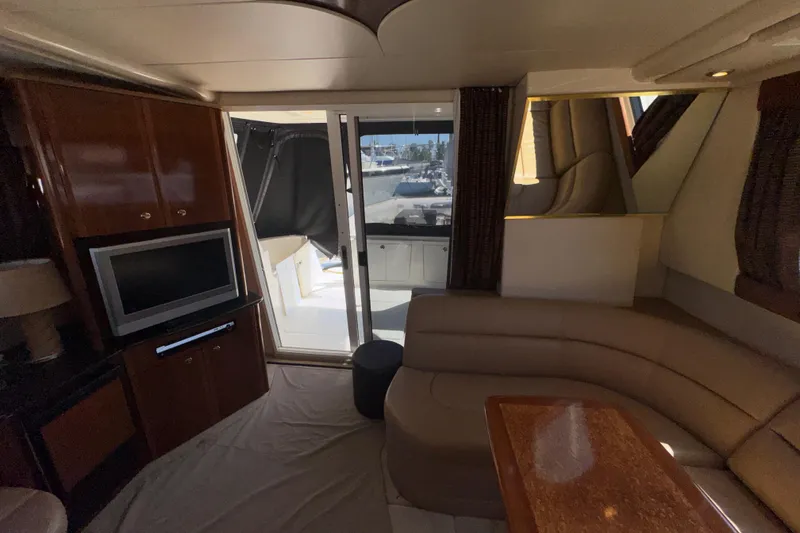 Slide: The Image of Interior of 2007 Meridian 411 Sedan yacht with TV, seating, and outdoor view. - 4