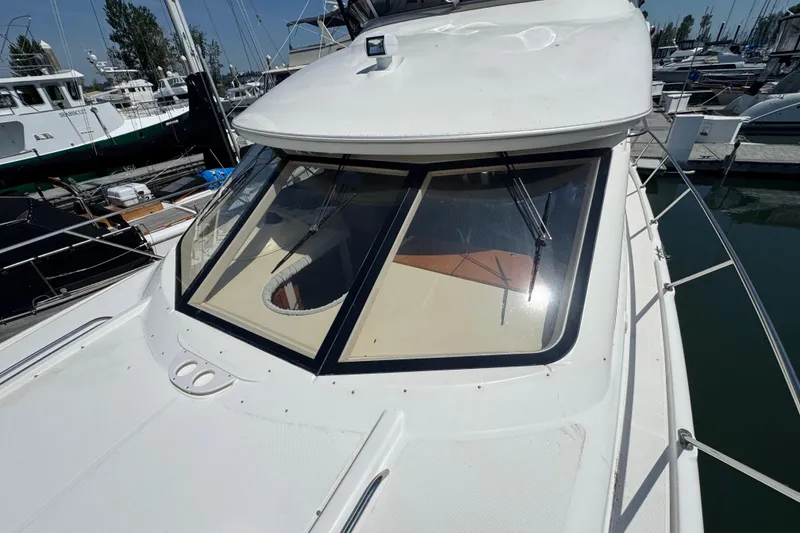 Slide: The Image of 2007 Meridian 411 Sedan yacht docked at marina, showcasing sleek design and spacious deck. - 41