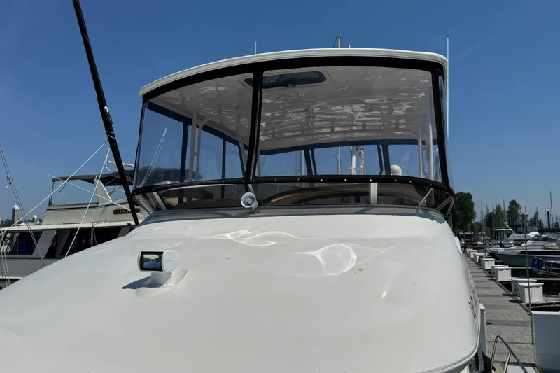 Slide: The Image of 2007 Meridian 411 Sedan yacht docked at marina under clear blue sky. - 42