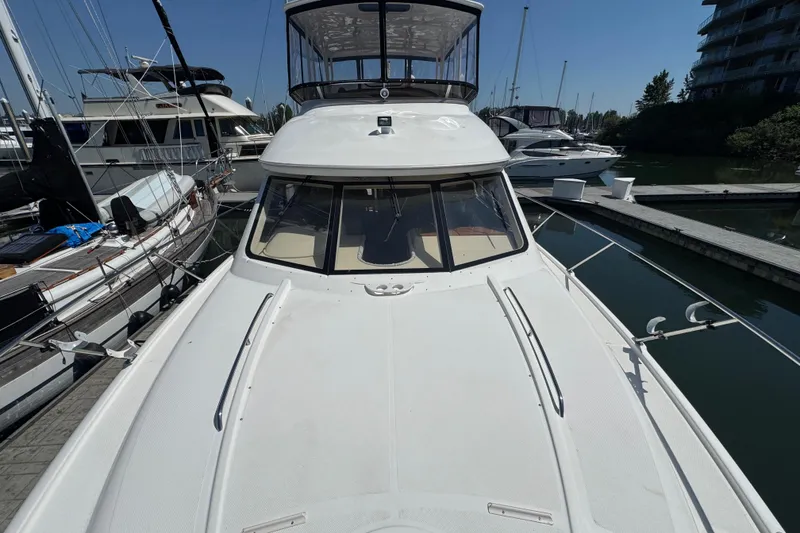 Slide: The Image of 2007 Meridian 411 Sedan yacht docked at marina under clear blue sky. - 43