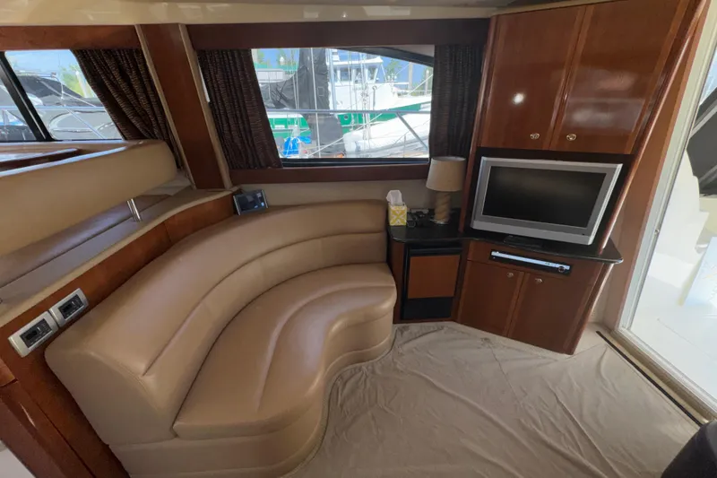 Slide: The Image of Luxurious interior of 2007 Meridian 411 Sedan yacht with curved seating and entertainment area. - 5