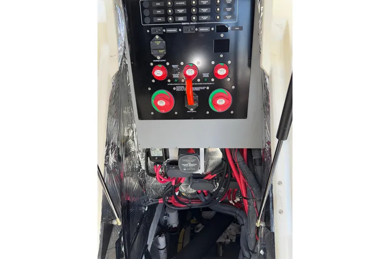 Slide: The Image of Electrical panel of a 2007 Meridian 411 Sedan boat with wiring and switches. - 50