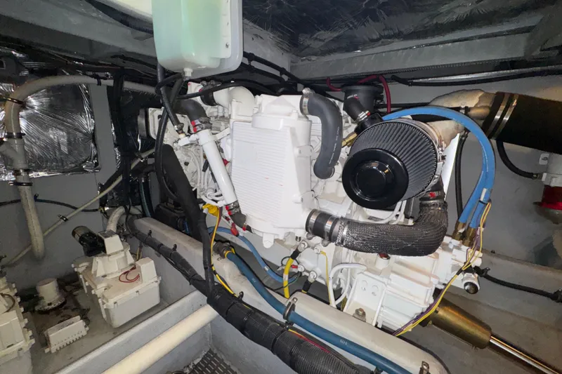 Slide: The Image of Engine room of a 2007 Meridian 411 Sedan, showcasing mechanical components and wiring. - 52