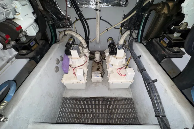 Slide: The Image of Engine room of a 2007 Meridian 411 Sedan with visible mechanical components and wiring. - 54