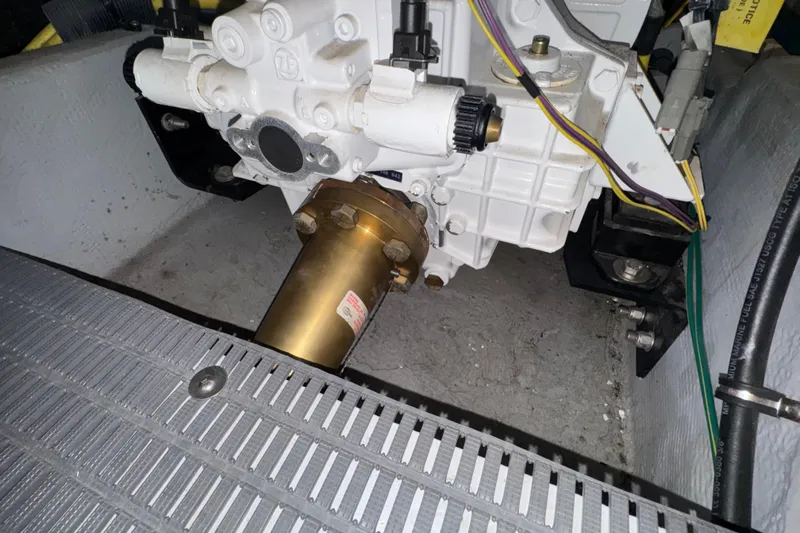 Slide: The Image of Engine compartment of a 2007 Meridian 411 Sedan, showcasing mechanical components and wiring. - 55