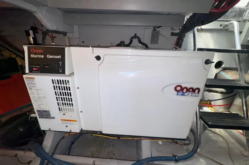 Slide: The Image of Onan marine generator in a 2007 Meridian 411 Sedan engine room. - 57