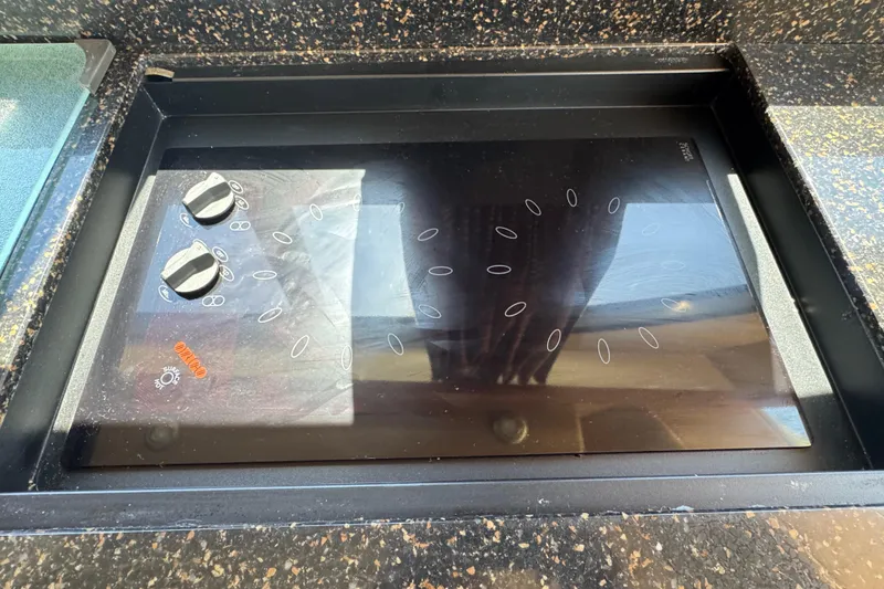 Slide: The Image of Built-in electric cooktop on a Meridian 411 Sedan yacht, 2007 model. - 58