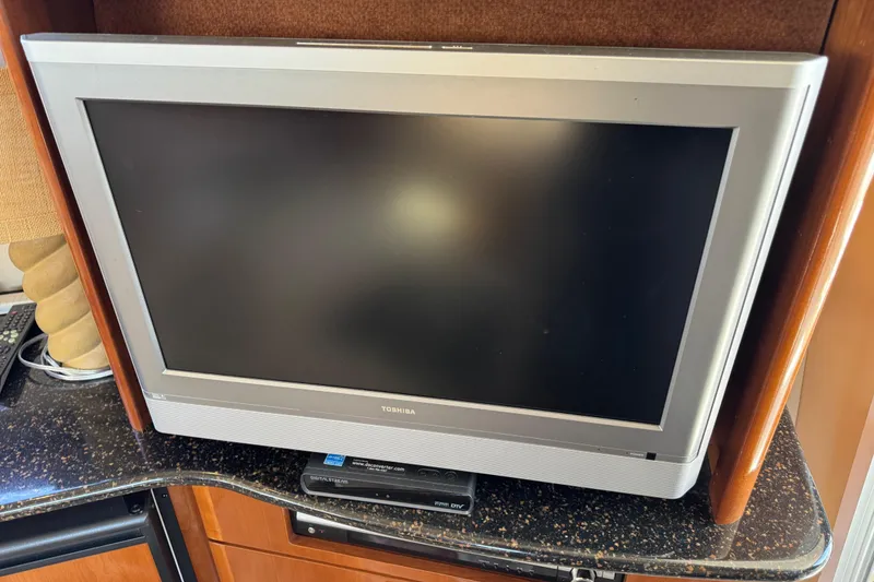 Slide: The Image of Toshiba TV on granite countertop in 2007 Meridian 411 Sedan yacht interior. - 59