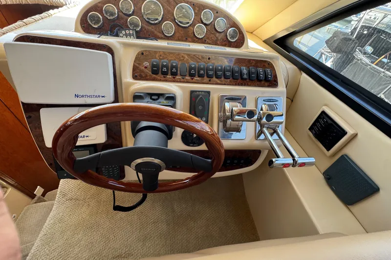 Slide: The Image of Dashboard of a 2007 Meridian 411 Sedan yacht with wood accents and Northstar navigation. - 67