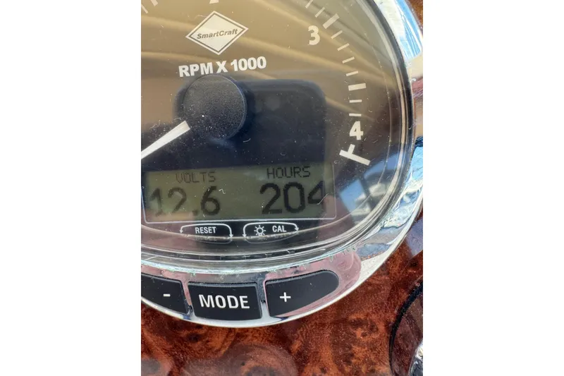 Slide: The Image of Close-up of a 2007 Meridian 411 Sedan RPM gauge displaying 12.6 volts and 204 hours. - 69