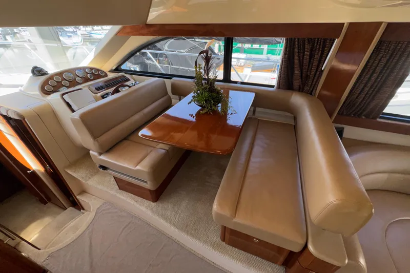 Slide: The Image of Luxurious interior of 2007 Meridian 411 Sedan yacht with plush seating and elegant table. - 8