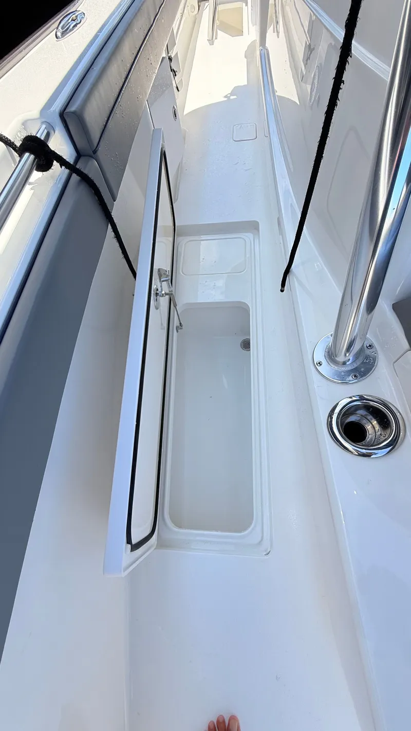 Slide: The Image of Valhalla Boatworks V33 2026 with open deck storage compartment. - 10