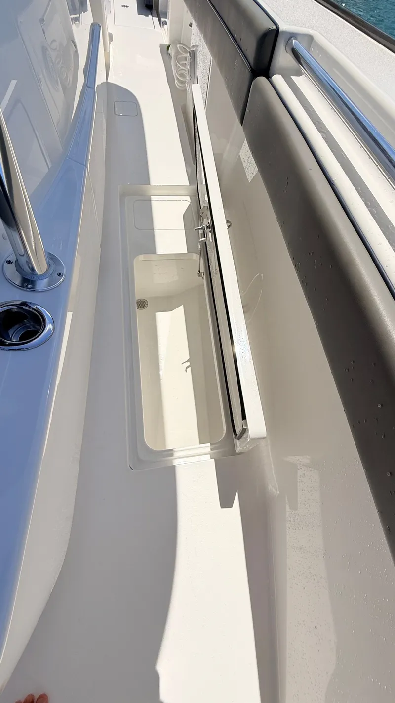 Slide: The Image of Valhalla Boatworks V33 2026 with open storage compartment on deck. - 11
