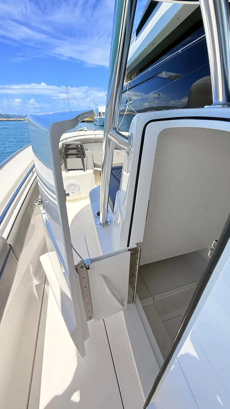 Slide: The Image of Valhalla Boatworks V33 2026, modern boat design, open door, sunny day. - 13
