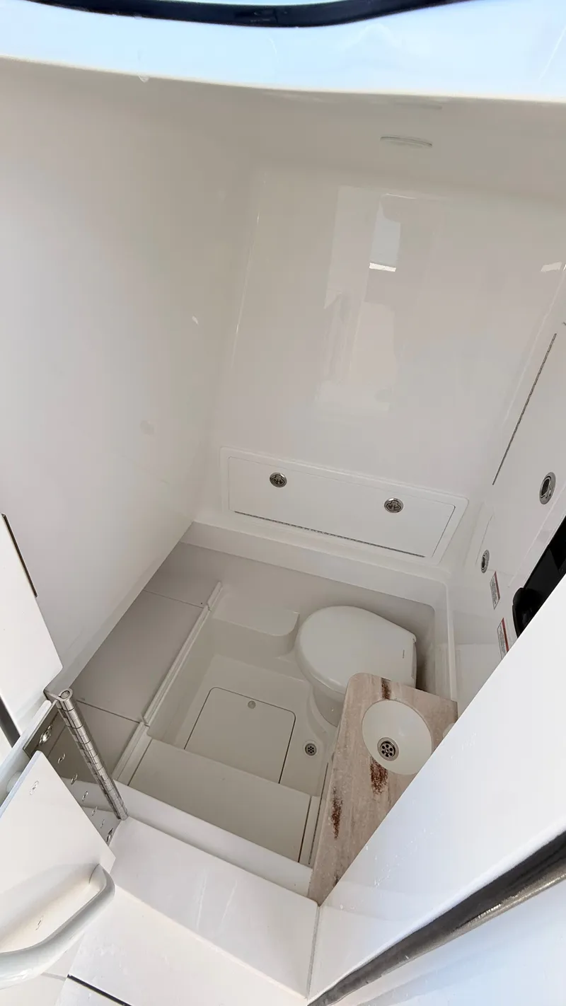 Slide: The Image of Interior of 2026 Valhalla Boatworks V33 with toilet and storage. - 14