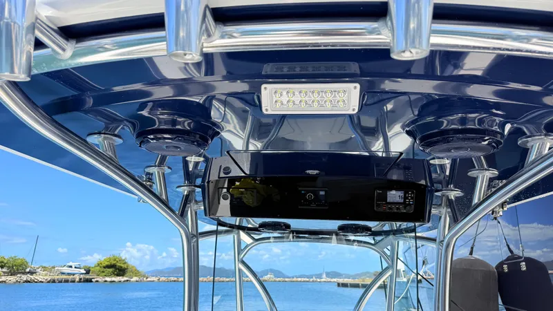 Slide: The Image of Interior view of 2026 Valhalla Boatworks V33 with blue canopy. - 2
