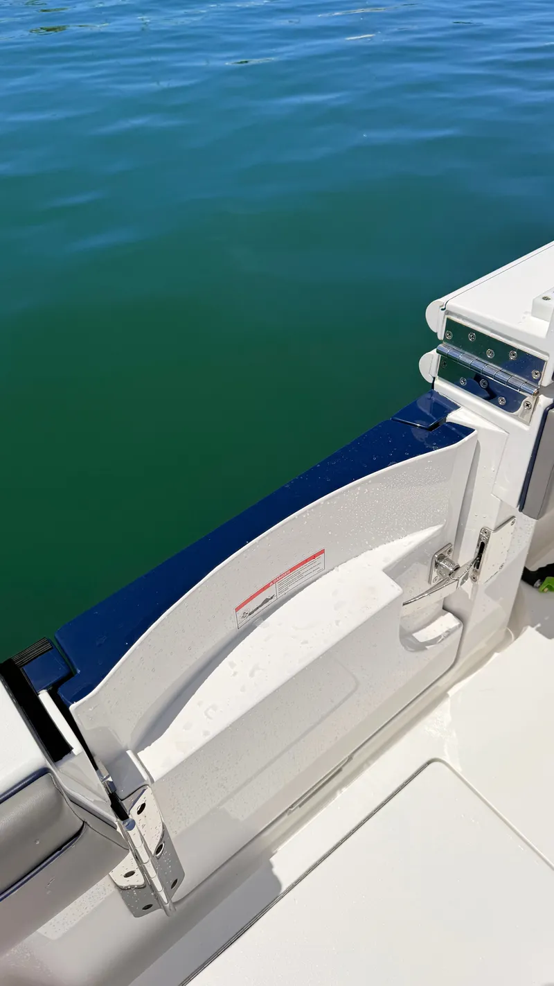 Slide: The Image of Valhalla Boatworks V33 2026, boat door by the water. - 22