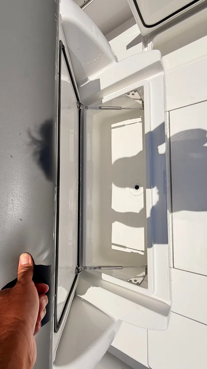 Slide: The Image of Valhalla Boatworks V33 2026, open storage compartment on a boat. - 26