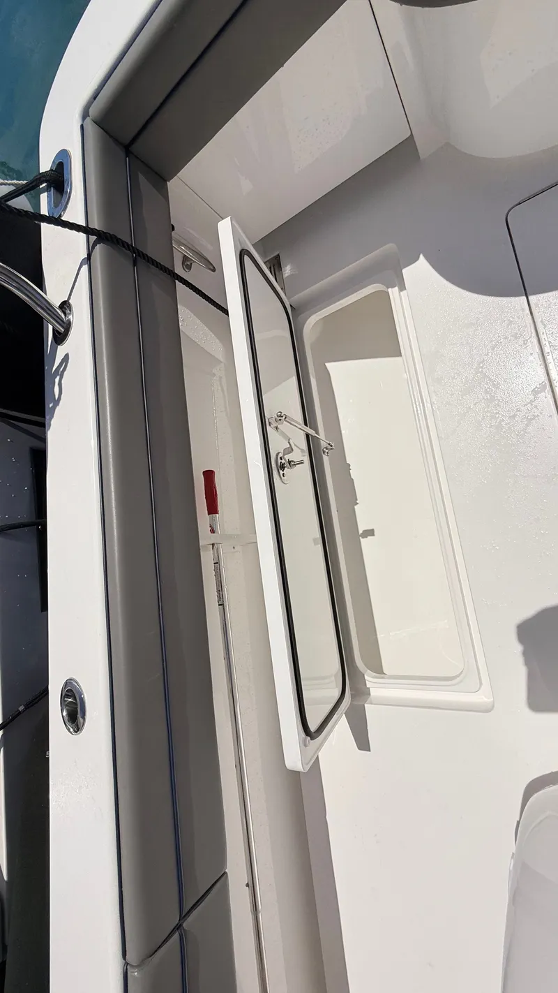 Slide: The Image of Valhalla Boatworks V33 2026, open storage hatch on deck. - 27