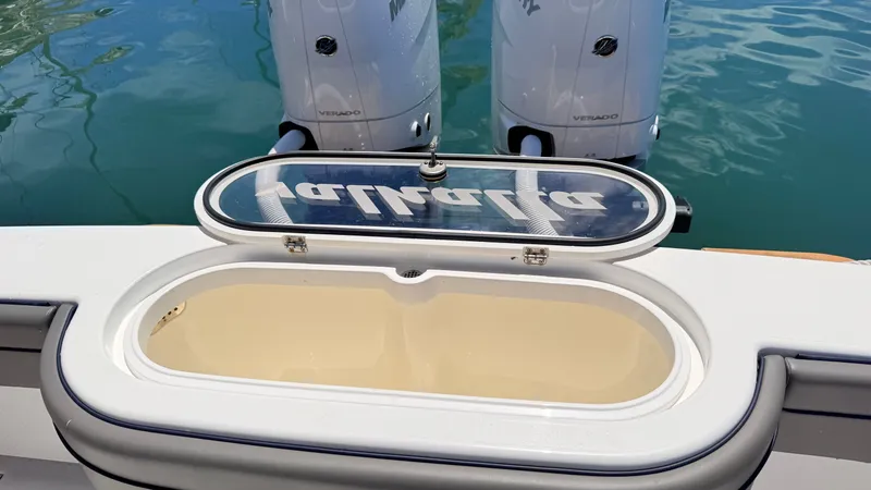Slide: The Image of Valhalla Boatworks V33 2026 with open storage compartment and engines. - 32