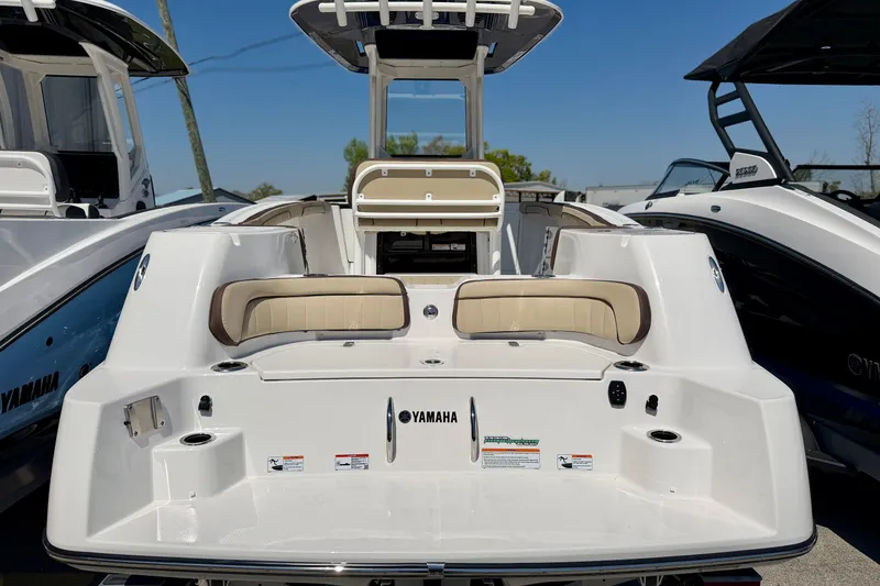 Slide: The Image of 2026 Yamaha Boats 255 FSH Sport H dashboard with steering wheel and control panel. - 11