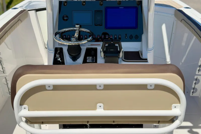 Slide: The Image of 2026 Yamaha Boats 255 FSH Sport H, rear view, showcasing seating and design features. - 2
