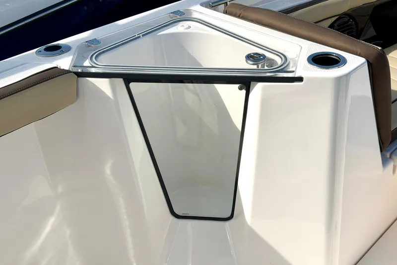 Slide: The Image of 2026 Yamaha Boats 255 FSH Sport H interior detail with cup holders and seating. - 22