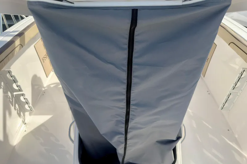 Slide: The Image of 2026 Yamaha Boats 255 FSH Sport H interior with protective cover and sleek design. - 26