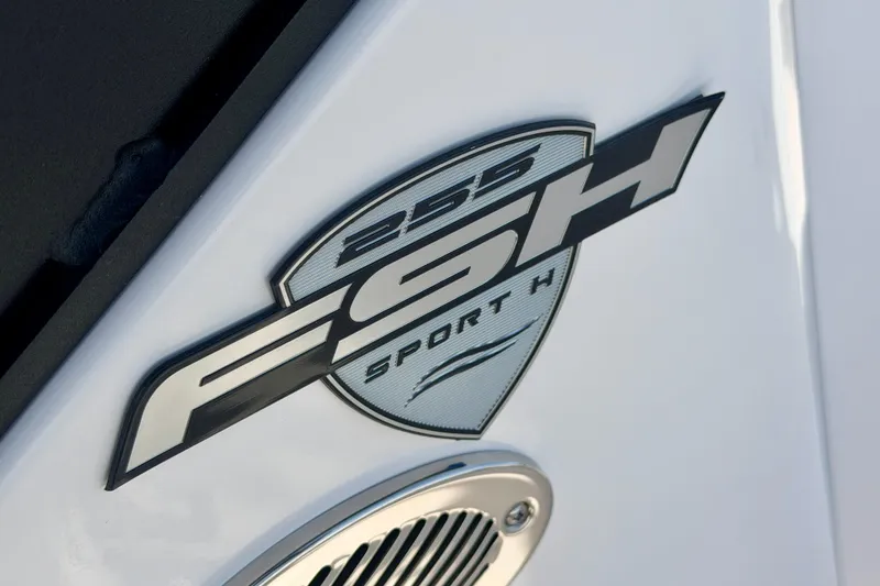 Slide: The Image of 2026 Yamaha Boats 255 FSH Sport H logo on white surface. - 33