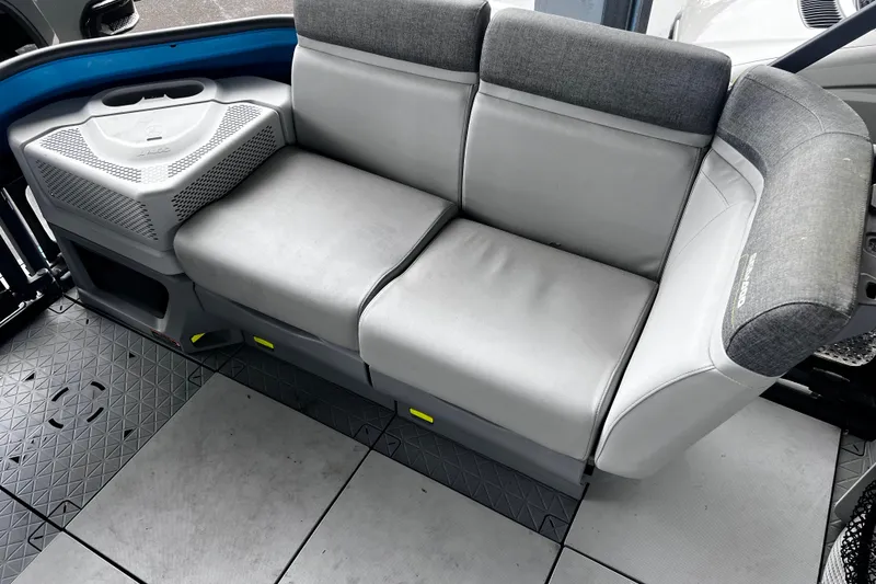 Slide: The Image of 2023 Sea-Doo Switch Cruise 18 interior seating with gray upholstery and modern design. - 12