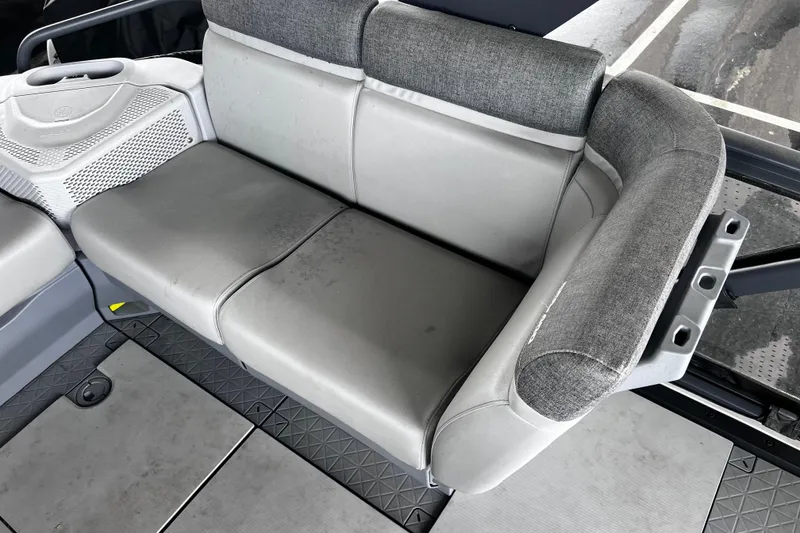 Slide: The Image of 2023 Sea-Doo Switch Cruise 18 interior seating with gray upholstery and modern design. - 14